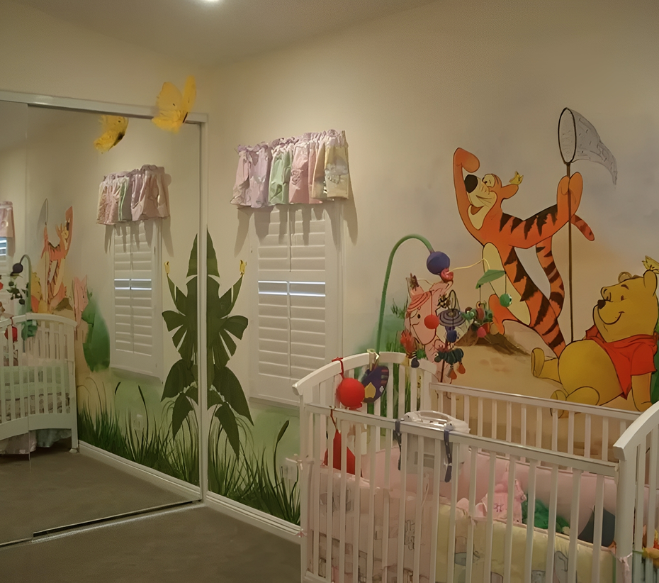 Nursery with cartoon-themed wall art